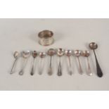 A quantity of silver condiment spoons plus a silver napkin ring with foliate decoration,