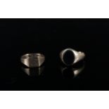 Two 9ct gold gents rings, one set with onyx (as found) the other with engraved monogram,