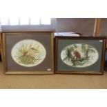 Two framed watercolours in oval mounts,