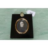 An 18th Century portrait miniature on ivory of a lady wearing a bonnet in ebony frame,