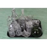 A tray of Victorian glassware including two decanters, two cut glass jugs, two lidded pickle jars,