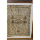 A large framed sampler on linen with biblical texts within a decorative border by Janet Hume ages 8