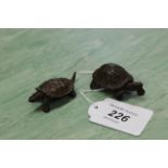 A pair of bronze tortoises,