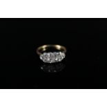 An 18ct gold diamond ring with two rows of old cut diamonds set in white metal (possibly platinum),