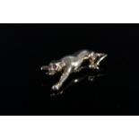 A 9ct gold leopard form brooch with gem set eyes, approx 16.