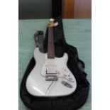 An Aria electric guitar with gig case
