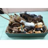 A quantity of porcelain models of horses, huntsmen and dogs including a large dray horse and cart,