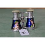 A pair of 19th Century opera glasses with white metal body and hand painted barrels with male and
