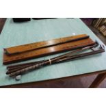 Four vintage golf clubs plus a wall plaque with putter bearing the title 'Estuary Club Golf Circle,