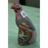 A 20th Century Chinese porcelain multi coloured game bird seated on a rock