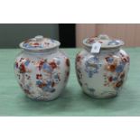 A pair of 20th Century Chinese porcelain armorial ginger jars in Imari palette