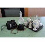 A large cut glass liqueur decanter on faceted foot and pinnacle stopper, two glass decanters,