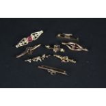 Eight 9ct gold bar brooches, some stone set (most are as found, all have metal pins),