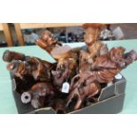 A box with a good selection of carved wooden and resin figures