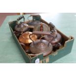 A tray of six vintage brass and copper kettles