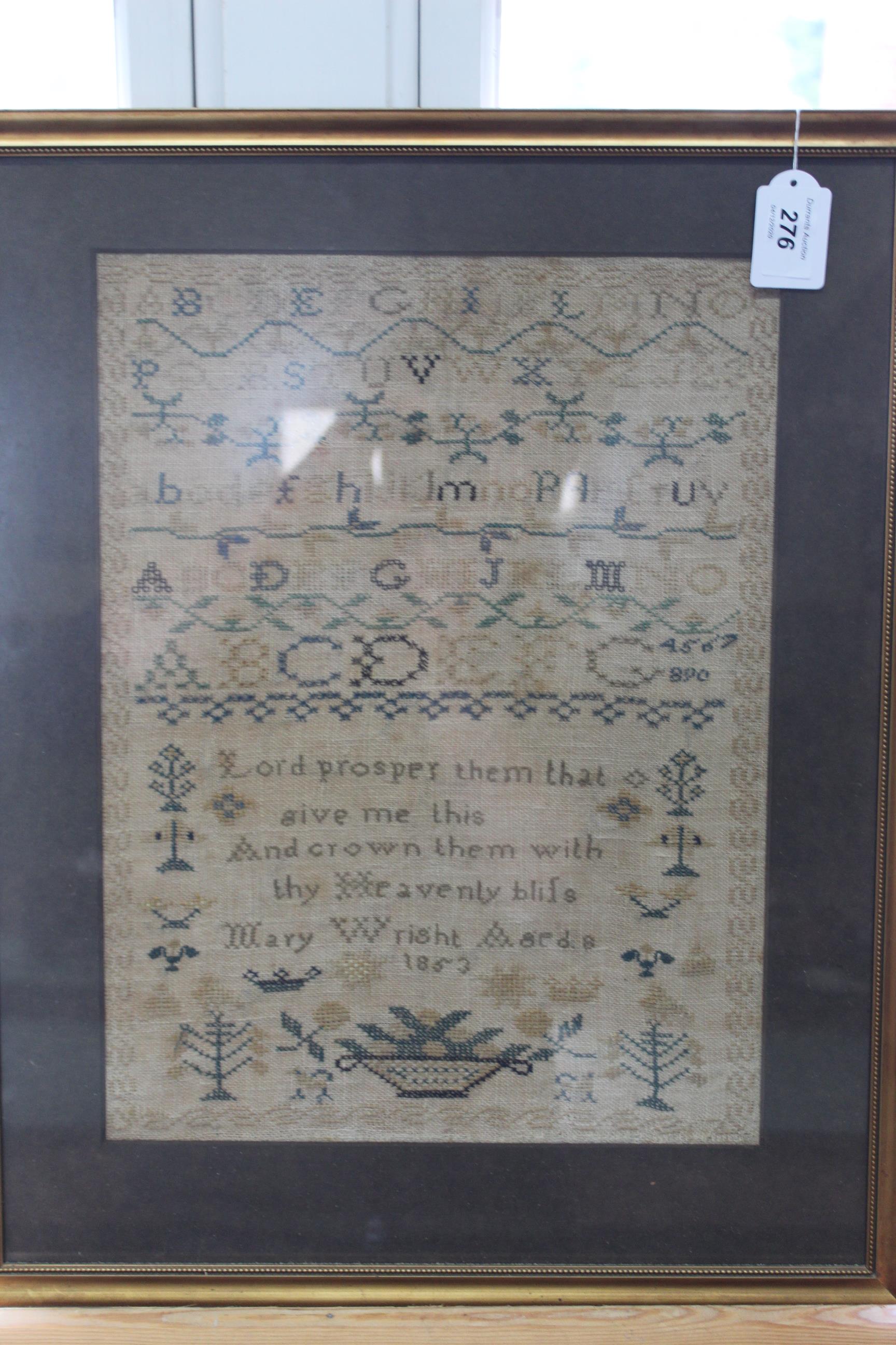 A framed Victorian sampler signed Mary Wright and dated 1853,