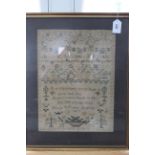 A framed Victorian sampler signed Mary Wright and dated 1853,