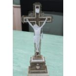 A large wooden cross with applied moulded decoration,