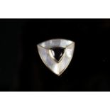 A 9ct gold brooch of triangular form set with a large amethyst centre, mother of pearl border,