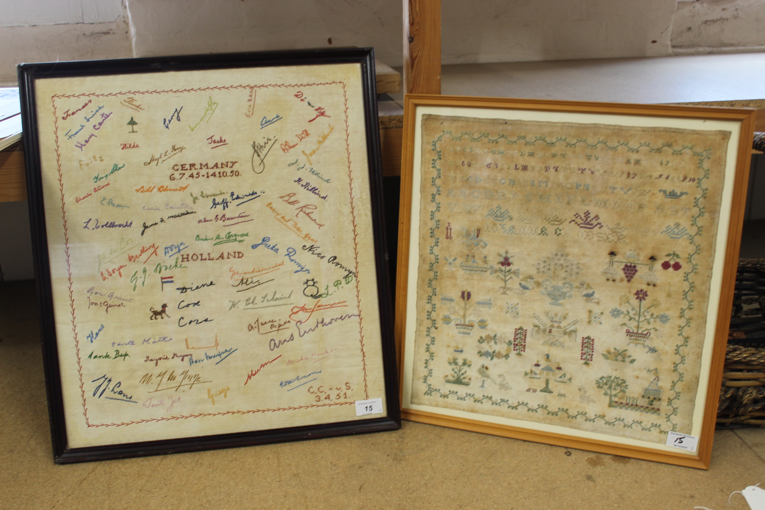 A framed sampler of flowers and birds,