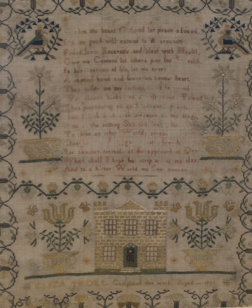 A framed sampler with verse within and decorative border with house by Eliza Troll, - Image 2 of 2