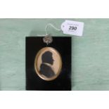 A framed Regency period silhouette of a gentleman in pen, ink and watercolour,