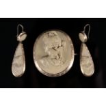 A large lava cameo brooch with carved female image,