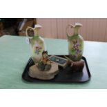 A pair of Victorian porcelain ewers with pink fuchsia decoration and composition figure of a