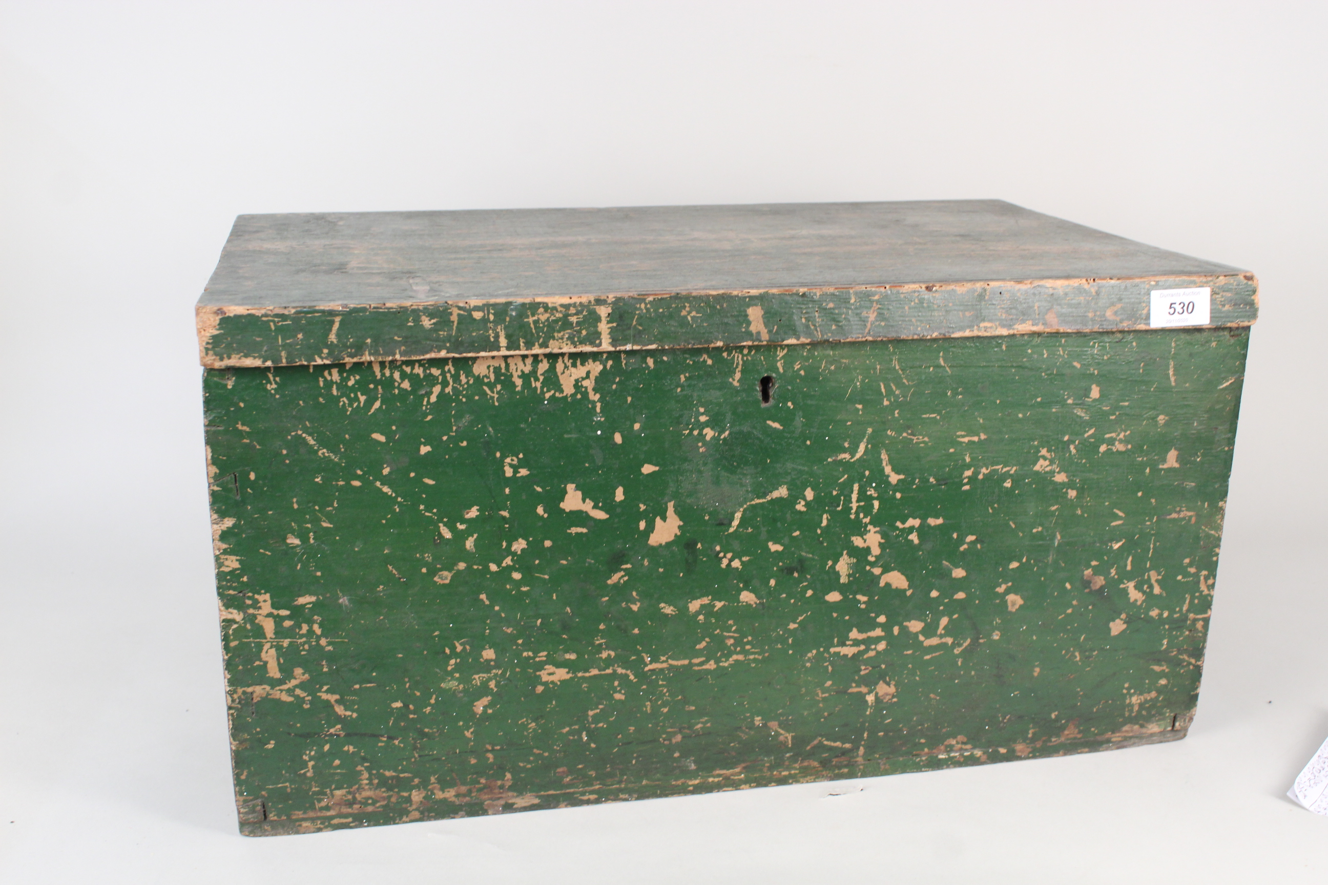 A vintage pine painted box containing assorted mantel and alarm clocks