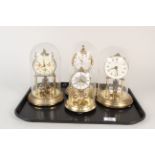 Four assorted brass dome clocks