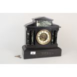 A late 19th Century black marble mantel clock