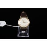 A gents 9ct gold Garrard wristwatch