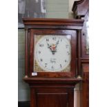 An early 19th Century oak long case clock, 30 hour duration, with square painted dial,