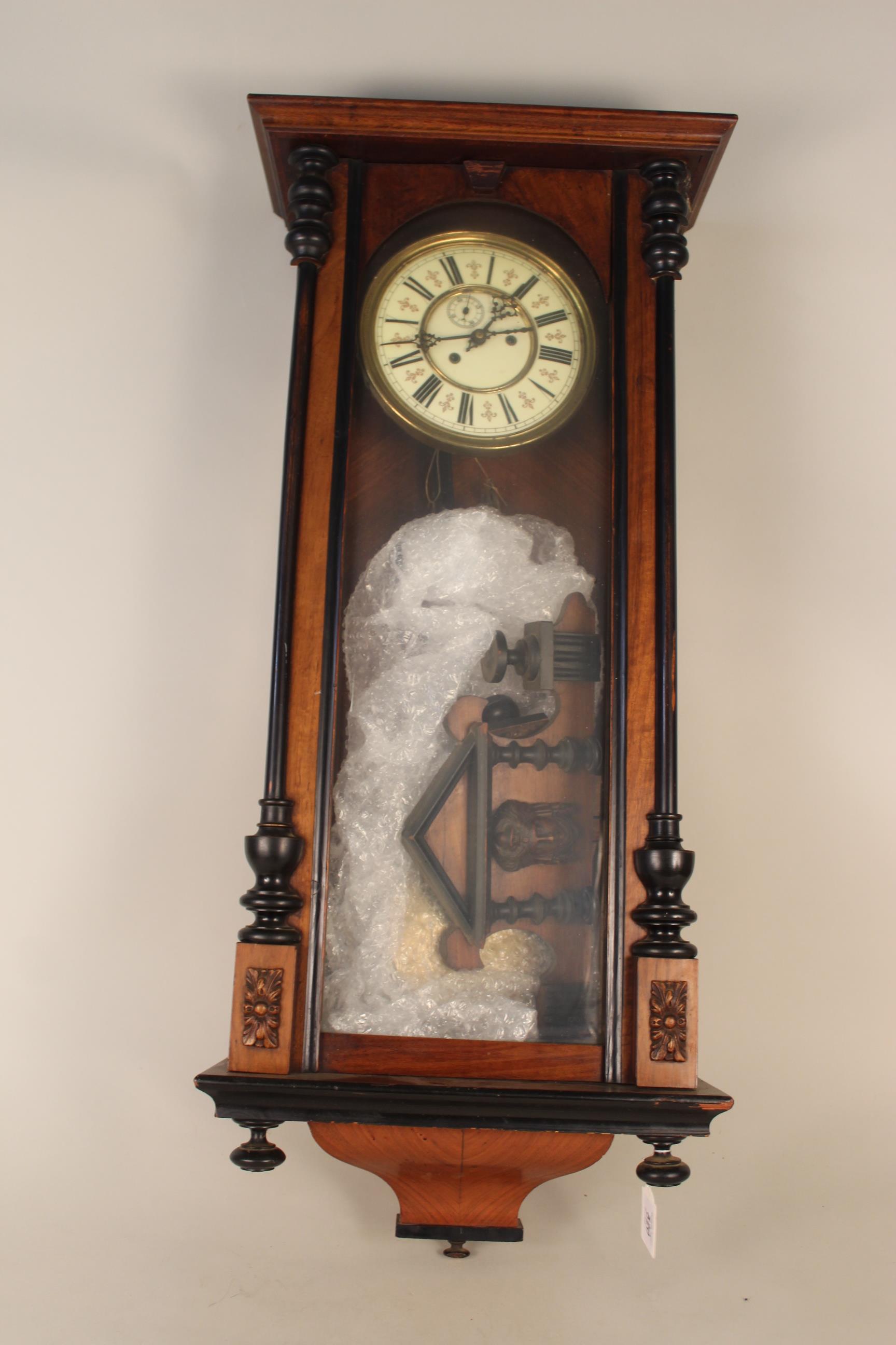 A mahogany cased Vienna wall clock