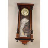 A mahogany cased Vienna wall clock