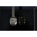 A Longines lady's automatic stainless steel wristwatch plus a lady's Gucci quartz watch