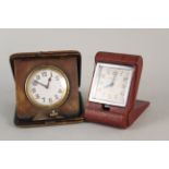 Two 1950's leather cased travel clocks