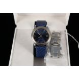A gents Zenith Espada quartz wristwatch with deep blue dial and spare blue strap,