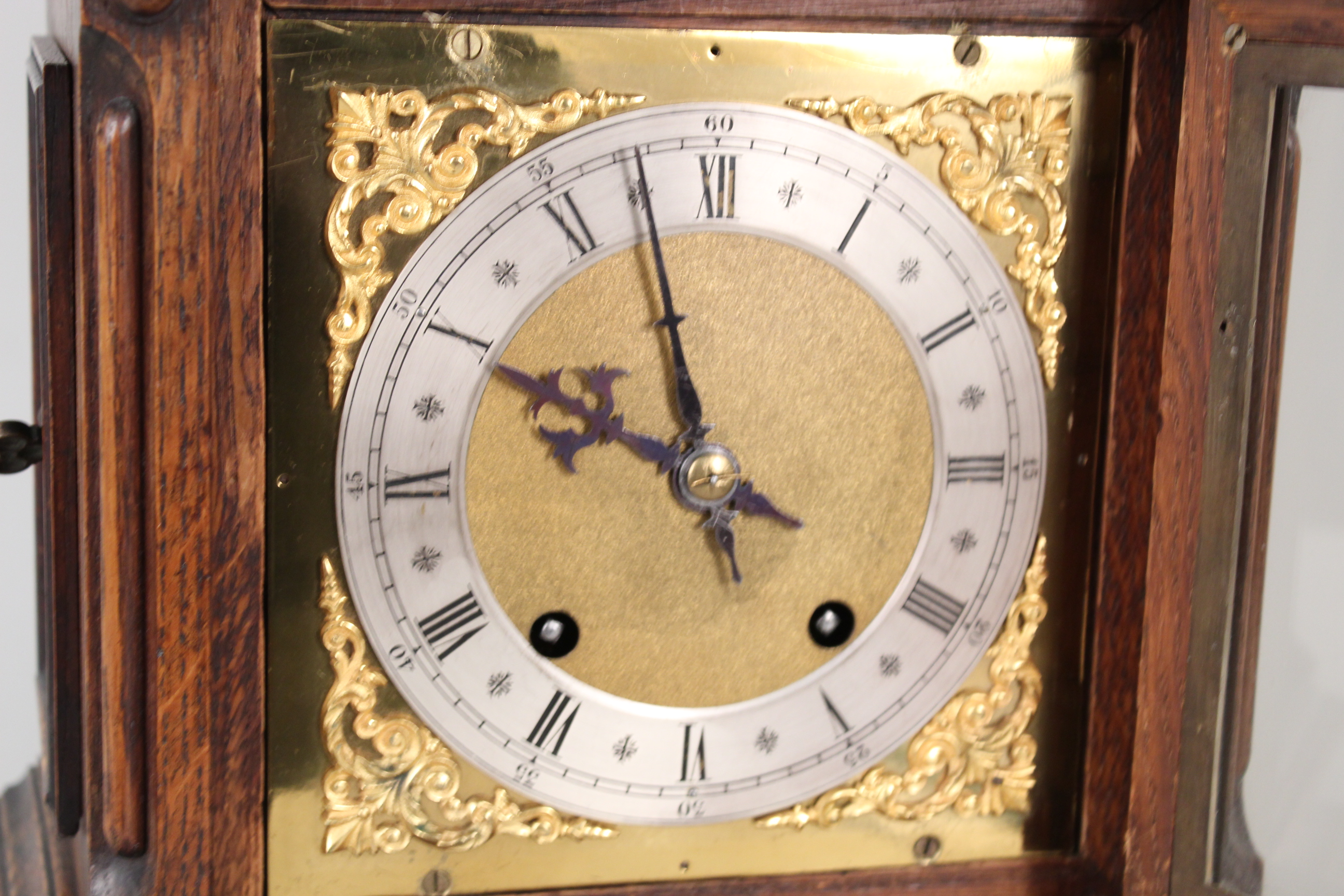 A carved oak cased brass and silver dialled mantel clock with construction sketches - Image 2 of 3