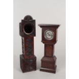 A heavy carved oak watch stand/clock holder with ornate carving on three sides,