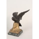 An early 20th Century bronzed spelter eagle pocket watch stand on marbleised base,