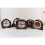 Five assorted oak cased 1950's mantel clocks