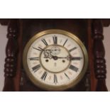 An oak and stained pine Vienna style wall clock