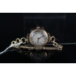 A lady's 9ct gold fob watch on a 9ct gold bracelet
