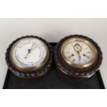 An American ships clock by Ansonia plus a similar cased barometer