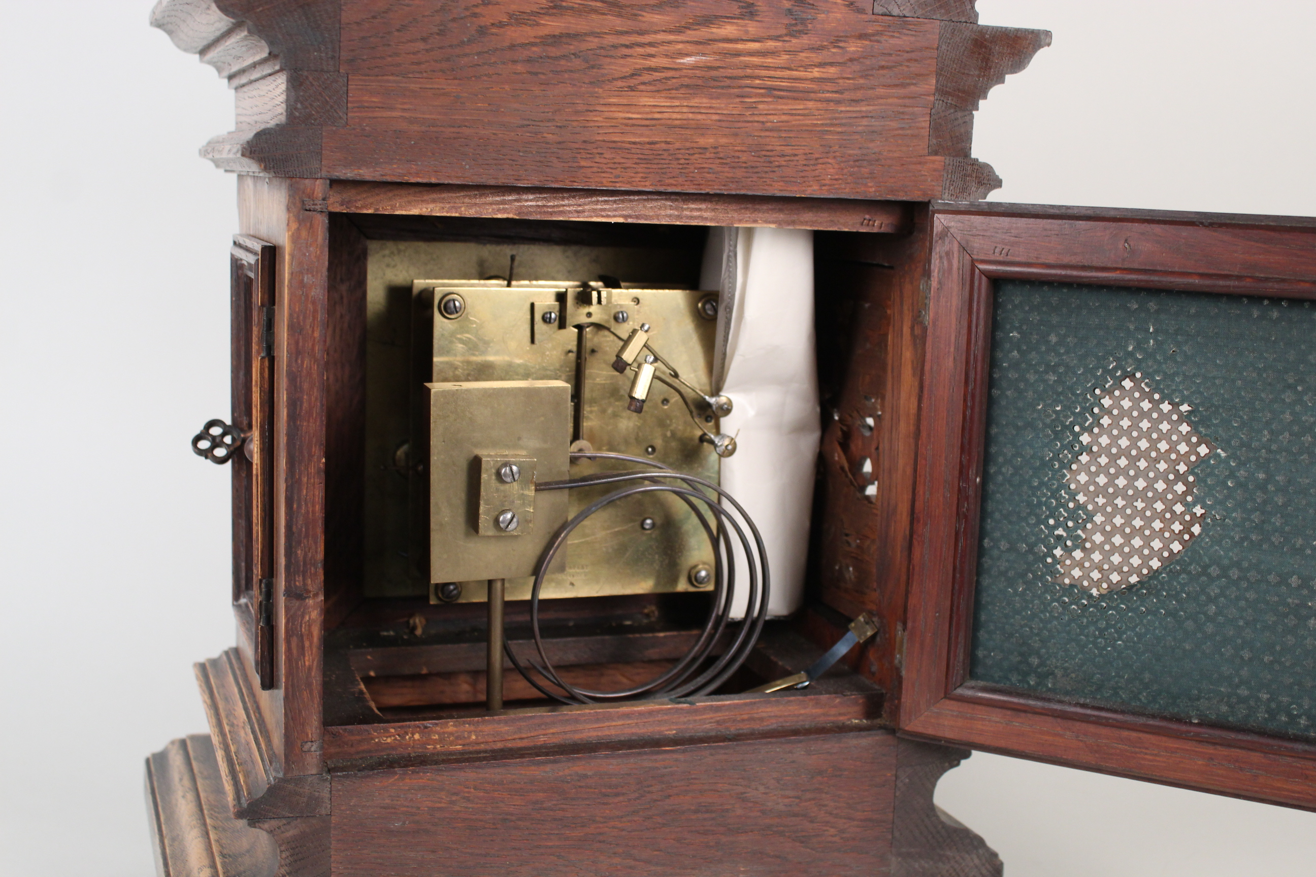 A carved oak cased brass and silver dialled mantel clock with construction sketches - Image 3 of 3