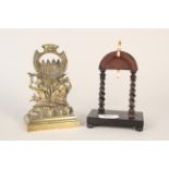 A 19th Century brass pocket watch stand with two classical figures,