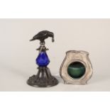 An early 20th Century hallmarked silver pocket watch stand, green leather easel back,