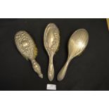 Three Silver Brushes