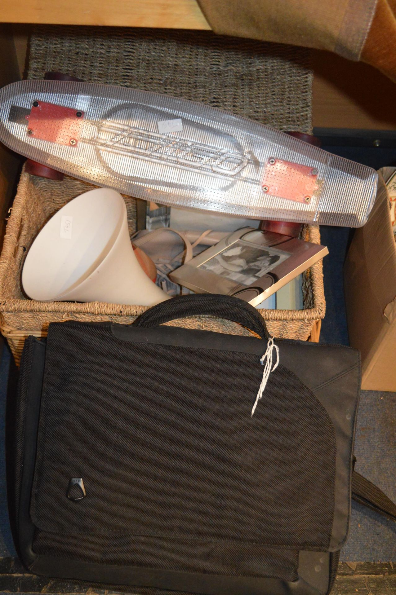 Two Basket Containing Household Items and a Skateb